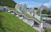 Pitched green roof with lawn and sail-shaped skylights